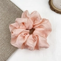 Pink satin scrunchie with a glossy silk finish shown on a minimalist background - Rose Pink