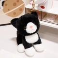 Cute black and white plush cat keychain with golden metal clasp and fluffy fur texture - Black & White Cat