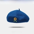 Dark blue wool beret featuring detailed sunflower embroidery in a classic artist style - One Size / Cyan Blue