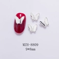 Macro detail of 9x8mm hollow metal butterfly nail charms with shiny silver finish - Silver 3D Butterfly (8809)