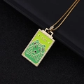 Gold Leo tarot pendant necklace with green enamel lion pattern and infinity symbol - 02-Green Lion Head