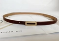 Detail of slim dark brown leather belt for women featuring a gold rectangular buckle - Pearl Gold Long Hollow Buckle / Coffee