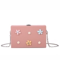 Pink matte hard shell crossbody bag with colorful 3D floral accents and silver chain - Pink