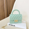 Mint green jelly bag with quilted pattern, beaded handle, and gold chain strap - Light Green