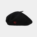 Detailed view of red heart embroidery on a black vintage wool beret for women - One Size / Black