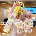 Yellow silicone keychain with star shaped liquid sand pendant and Happy wrist strap - Fresh Star - Yellow