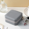 Portable gray square faux leather jewelry travel box with a secure zipper closure - Small Square Box Grey