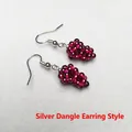 Detail view of handmade silver drop earrings with burgundy grape-shaped bead clusters - Silver Drop Earrings Pair / Silver