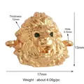 Macro view of gold-plated lion head jewelry connector with green cubic zirconia eyes - Gold Plated Lion Head with Zirconia