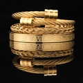 Detail of gold cable wire bracelets with roman numerals on black mirror background - Gold Round Head Set