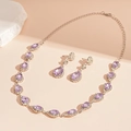 Dettaglio del set di gioielli di lusso con cristallo viola a goccia e orecchini - Goccia d'Acqua Viola (Set da 2 pezzi)