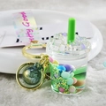 Creative milk tea cup keychain with green straw, pearl beads, and gold metal keyring - Lanyard Style / Green