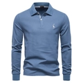 Detail of blue long-sleeve polo shirt featuring a giraffe embroidery and collar label - Denim Blue