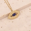 Detail of a vintage gold necklace featuring an oval blue natural stone on a beige stone base - Blue Gemstone Sun Style (4#)