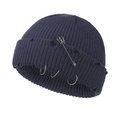 Detailed view of dark blue knit beanie with metal pins, rings and distressed ripped texture - 55-58cm / Grey Blue
