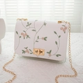 White transparent crossbody bag with pink floral embroidery and golden chain strap - White