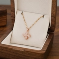 Rotating four-leaf clover pendant necklace in rose gold finish with white zircons - Rose Gold