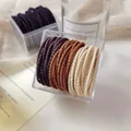 Elastische Spiral-Haargummis in Erdtönen und Cremeweiß in einer klaren Acrylbox - Dunkle Farben in Box (50 Stück/Packung)