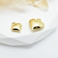 Polished 18k gold plated heart pendants in two sizes displayed on white geometric stands - 8mm / Gold