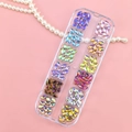 12-grid storage box with colorful leaf-shaped nail art rhinestones on pink background - 12 Colors AB Colorful Horse Eye Rhinestones
