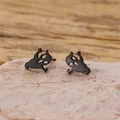 Macro detail of cute black cartoon ghost stud earrings made of stainless steel for Halloween - Large Ghost / Black