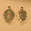 Macro detail of copper leaf charms with embossed Chinese characters and coins - Golden Feather & Car
