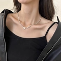 Silver minimalist heart pendant necklace featuring sleek metal bar details on a model - Stitched Heart Style (XL2826)