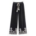 Damenhose mit weitem Bein in Schwarz mit weißer Stickerei und Quastengürtel - S / Schwarz