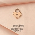 Macro shot of rose gold heart lock pendant with exact size specs on pink silk background - Rose Gold