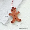 Gingerbread man wooden Christmas tree ornament with red bow and hanging string - Gingerbread Man A