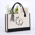 Beige cotton canvas tote bag with black summer vibe floral print and ribbon bow - Letter-I