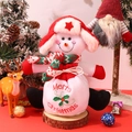 Detail of plush snowman Christmas gift bag with Merry Christmas embroidery on wooden stand - Snowman