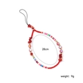 Detailed view of handmade beaded phone strap with red beads, 28cm length and 9g weight - Red Stone Round Bead Style
