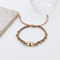 Boho layered woven bracelet with champagne cord and golden beads on white background - Handwoven Gold Ornament Style (JSS220031A)