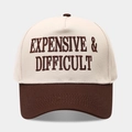 Detailed embroidery of Expensive & Difficult text on a two-tone baseball trucker cap - Adjustable / Beige/Coffee
