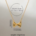 Collier avec pendentif nœud doré comprenant les dimensions et une chaîne de 45cm - Nœud