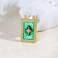 Macro detail of a vintage gold starburst pendant with green enamel and zircon accents - Green Starburst Style (ZYN-DMK874G-1)