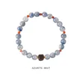 Macro shot of azurite beaded bracelet featuring sky blue stones and a square wooden bead - Azurite Sandalwood Square Bead Style (WB335)