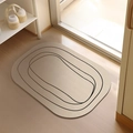 Alfombra de baño ovalada de diatomita beige con líneas negras en suelo de madera - 40x60cm / Lodo de diatomeas - Xi Yue
