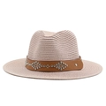 Close-up of woven straw cowboy hat with brown leather band and silver metal rivets decoration - Nude Pink