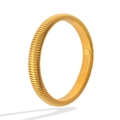 Detail shot of the golden Tubogas style titanium steel bangle with polished ribbed texture - Elastic Bracelet/10mm Width / Gold