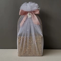 Detail of woven gift basket wrapped in star pattern tulle with a pink satin ribbon bow - Nude Pink Full Wrap Star Moon Mesh