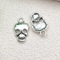 Antique silver skull charm for DIY jewelry making featuring intricate vintage metal details - Skull Head 10x16mm