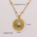 Gold stainless steel necklace featuring a hollow sunburst pendant with light blue natural stone - Amazonite