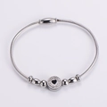 Detail of silver wire cable bracelet with sparkling rhinestone heart and magnetic clasp - Silver Clasp Silver Style / Silver