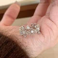 Hand wearing a silver flower ring with small diamonds in a vintage high-end style - JZ1267-Silver Wreath