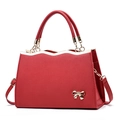 Elegant red bridal handbag with a gold bow accent and detachable shoulder strap - Burgundy