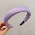 Padded satin headband in elegant purple color featuring a handmade inner woven label - Purple
