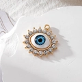 Golden sunburst evil eye pendant with blue resin eye and sparkling crystal rhinestones - Gold Pointed Rhinestone Blue Eye
