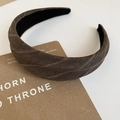 Close-up of brown twill fabric headband with silver geometric patterns and black inner lining - Headband / Brown